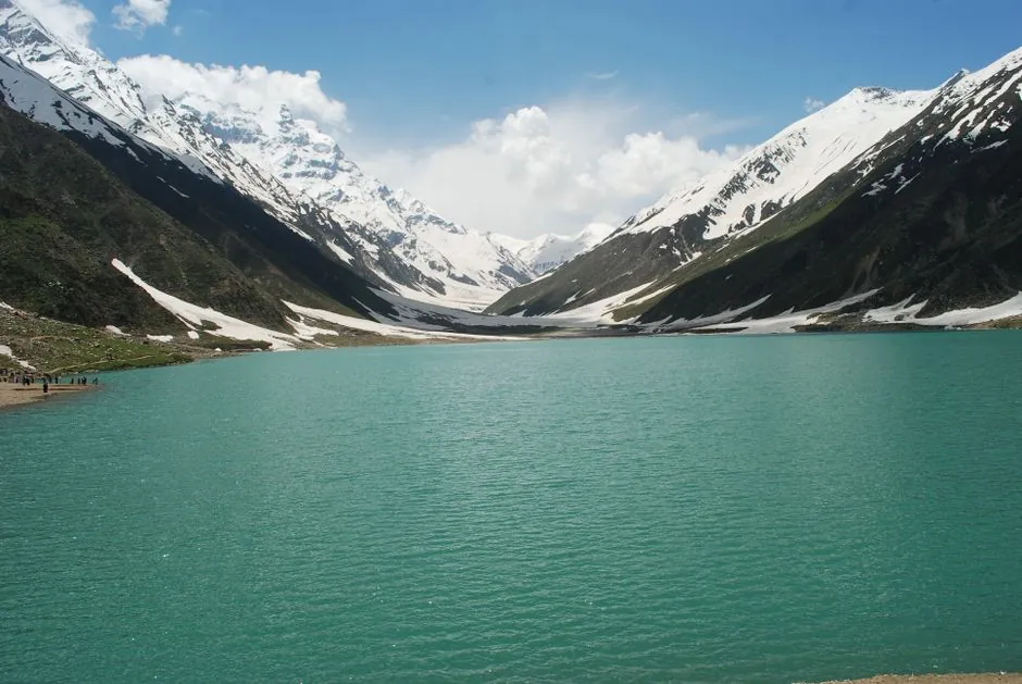 Beautiful Lake Saif-ul-Malook surrounded by snow-covered mountains in Khyber Pakhtunkhwa, Pakistan.